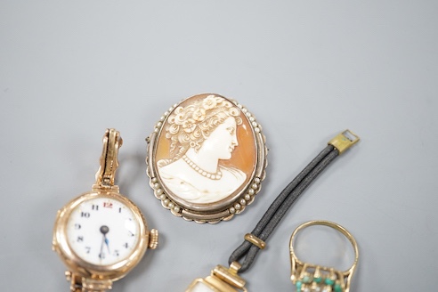 A lady's early 20th century 9ct gold manual wind wrist watch, on a 9ct strap, gross 16.4 grams, a lady's 18k watch, gross 9.9 grams, a cameo brooch and a 9ct dress ring.